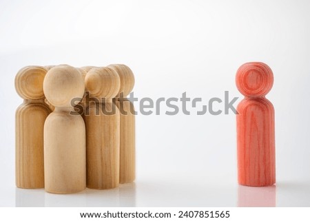 Closeup view crowd of wooden figures isolated over a white background