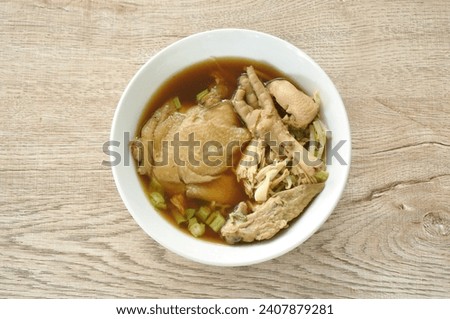 boiled braised chicken tight and meat with bean sprout in herb brown soup on bowl Royalty-Free Stock Photo #2407879281