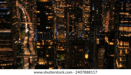 Helicopter Tourist Tour Around New York City at Night. Aerial View with a Picturesque Illuminated Office Buildings, Scenic View with Manhattan Skyscrapers Panorama