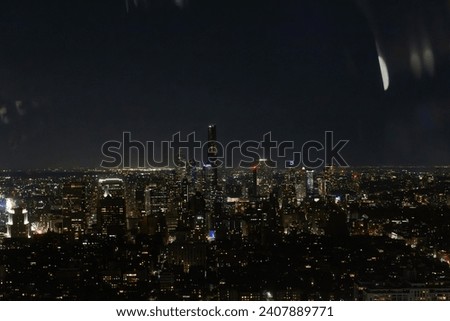 Aerial View of Manhattan Architecture at Night. Night Photo of Financial Business District from a Helicopter. Scenery of Historic Office Towers, Illuminated Skyscrapers