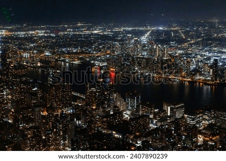Night Aerial Photo with New York City Skyscrapers with Lights in Office Rooms Inside. Helicopter View View Capturing Panorama of Manhattan