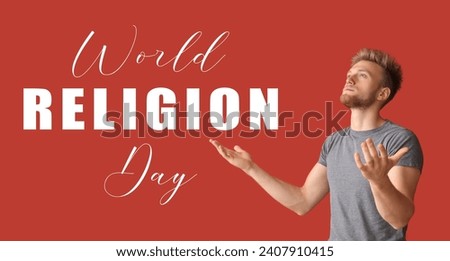 Young man praying to God on red background. Banner for World Religion Day