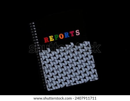 reports book on black background. Concept for business, office and education