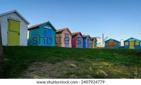 Amble Beach Huts at Warkworth Harbour. Amble Harbour is actually called Warkworth Harbour and is set on the banks of the River Coquet in Northumberland in the North East of England Royalty-Free Stock Photo #2407924779
