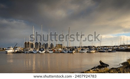 Amble Marina and Town beyond. Amble Harbour is actually called Warkworth Harbour and is set on the banks of the River Coquet in Northumberland in the North East of England Royalty-Free Stock Photo #2407924783