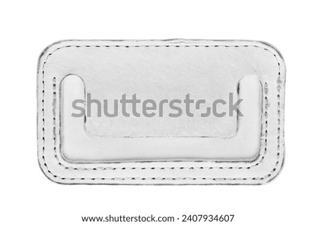 Blank stitched white leather patch label isolated on white background