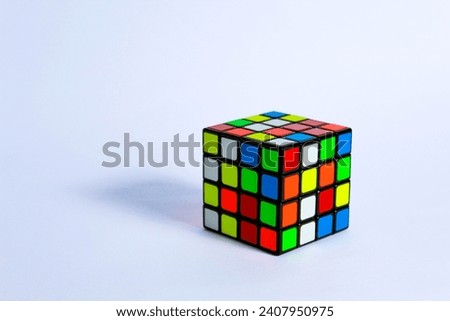 4x4 Rubiks cube shot in white background Royalty-Free Stock Photo #2407950975