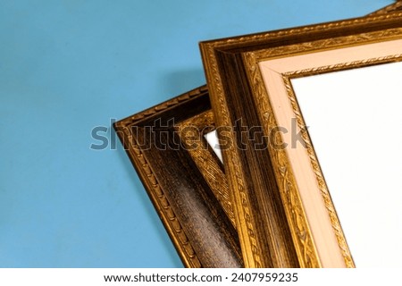Antique wooden picture frames. Old rustic wooden frames close-up. Antique carved gilded frame. Selected focus