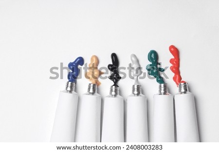Set of White tubes of acrylic or oil paint for creativity on white background. Template for design, mockup