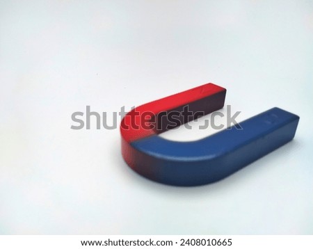 U-shaped magnetic bar on a light background