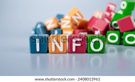 The word info is written on colorful cubes on a gray background