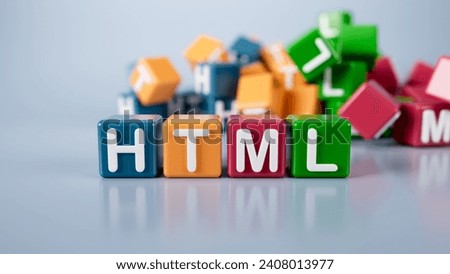 The word html is written on colorful cubes on a gray background