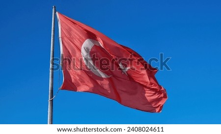 A closeup reveals the intricate details of the Turkish flag, symbolizing unity, heritage, and national pride.