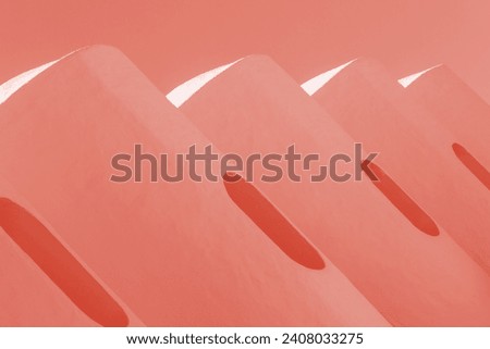 Abstract architecture background. Exterior walls with cylinder shape. Modern building details. red color cylindrical geometric forms, or circular. Contemporary, design, structure, close up. Concept