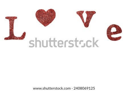 On a white background, the word Love consists of shiny red letters and a red heart. Copy space. The concept of love, infatuation, valentine's day, wedding.
