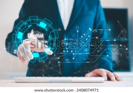 Businessman pressing on virtual screen in concept of Digital transformation in business. Leveraging modern technologies automation data analytics cloud computing and AI to increase efficiency Royalty-Free Stock Photo #2408074971