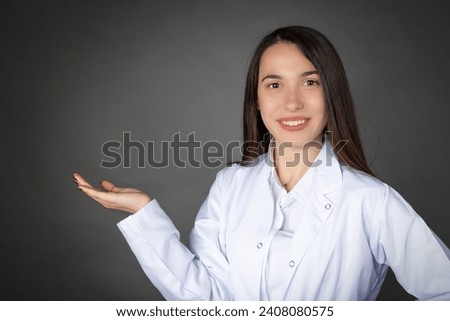 Turkish beautiful smiling young girl in doctor or chef clothes and empty tray pose