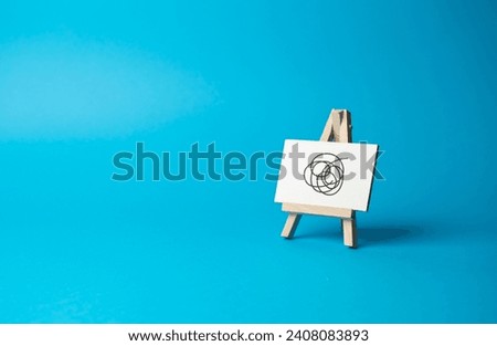 Easel sign with causeless doodles on a blue background. Nonsense is not worth your time and attention. Failed advertising campaign. Cut the nonsense. Go through difficulties and challenges. Royalty-Free Stock Photo #2408083893