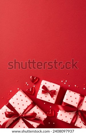 Valentine's Day gift box with hearts on red background.