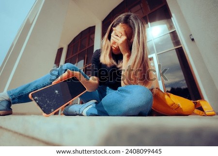 
Unhappy Person Dropping her Bag Smashing her Phone 
Upset desperate girl damaging the phone display 
 Royalty-Free Stock Photo #2408099445