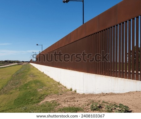 On Going Crisis at US Southern Border:  Border Wall between Texas and Mexico along the Rio Grande River; view from Mexican side of wall 