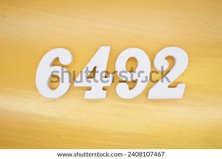 The golden yellow painted wood panel for the background, number 6492, is made from white painted wood.