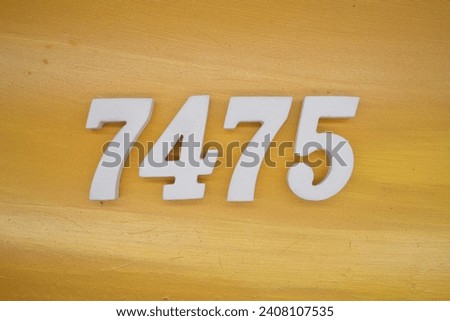 The golden yellow painted wood panel for the background, number 7475, is made from white painted wood.