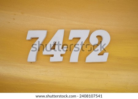 The golden yellow painted wood panel for the background, number 7472, is made from white painted wood.