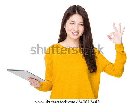 Woman use of tablet and ok sign