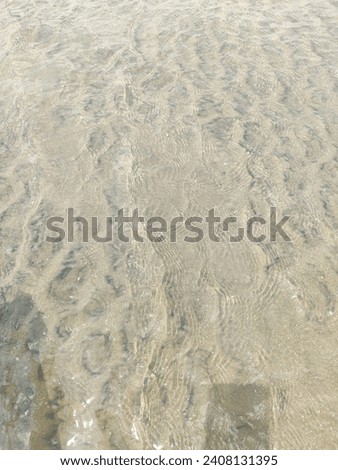 Beach with clean white sand and calm water
