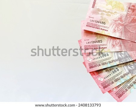 Hundread rupiah notes isolated in white, with space for text. Good idea for background