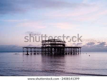 The Brighton West Pier was a historic Victorian-era pleasure pier located in Brighton, England. Built in 1866, it was renowned for its elegant design and served as a hub for entertainment. Royalty-Free Stock Photo #2408141399