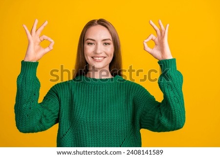 Portrait of boss girl showing two okey symbols good job nice feedback from hr manager in company isolated on yellow color background