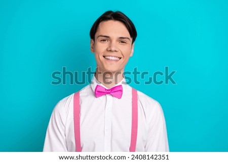 Photo portrait of pretty young male toothy smile look camera wear trendy pink outfit isolated on cyan color background