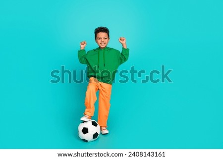 Full length photo of cheerful glad boy rejoice support team final league fifa championship isolated on cyan color background Royalty-Free Stock Photo #2408143161