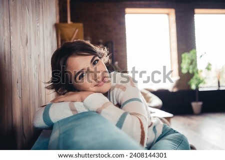 Photo of satisfied adorable girl sitting comfy sofa have good mood pastime morning chill apartment inside Royalty-Free Stock Photo #2408144301