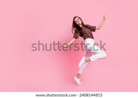 Full length profile portrait of cheerful stunning person dancing partying empty space isolated on pink color background