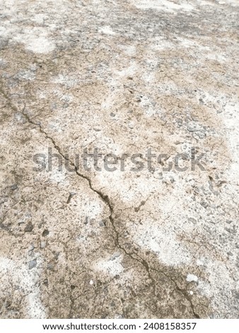 Palembang, Indonesia - January 4, 2024: Cement floor with slight cracks like lightning