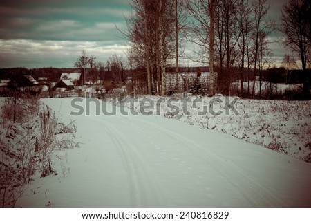country snowy road in winter, rural area - retro vintage look