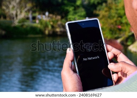 Mobile phone displaying no network coverage message.