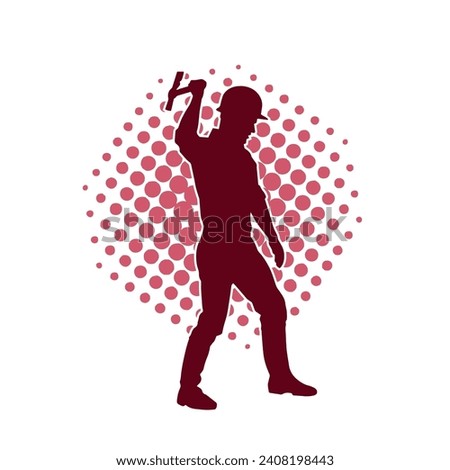 Silhouette of a worker in action pose using his axe tool. Royalty-Free Stock Photo #2408198443