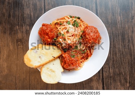 Fresh Spaghetti Alla Carrettiera on white plate