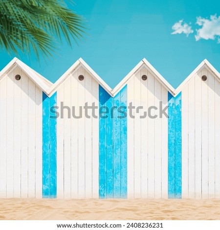 Wooden beach huts and palm trees, vacations on the beach concept, copy space Royalty-Free Stock Photo #2408236231