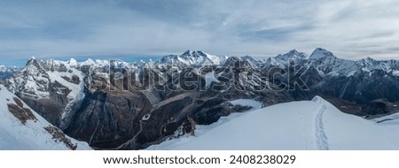 Mount Everest, Nuptse, Lhotse with South Face wall, Makalu, Chamlang beautiful panoramic shot of a High Himalayas from Mera peak high camp site at 5800m. 43MP high definition multishot photo. Royalty-Free Stock Photo #2408238029