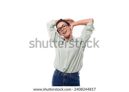 young energetic positive teacher woman with curly black hair dressed in a shirt and jeans