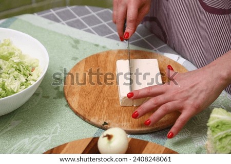 Cutting cheese on the kitchen