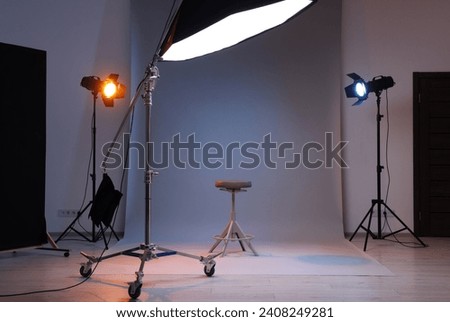 Casting call. Chair and different equipment in modern studio Royalty-Free Stock Photo #2408249281