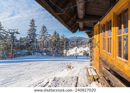 Mountain hut in Wierchomla ski area on sunny winter day, Poland