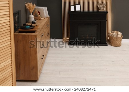 Stylish room with decorative fireplace. Interior design