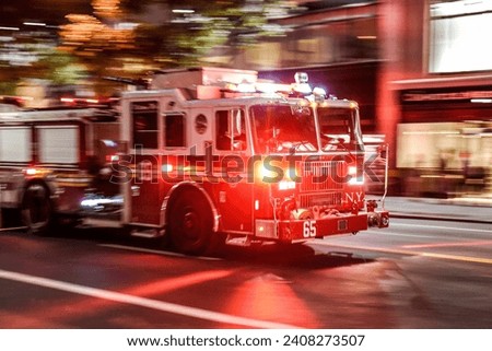 New York, NY USA Fire truck with emergency lights on the street of Manhattan Royalty-Free Stock Photo #2408273507
